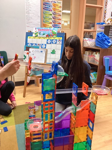 Showing off the contraption made for marble races