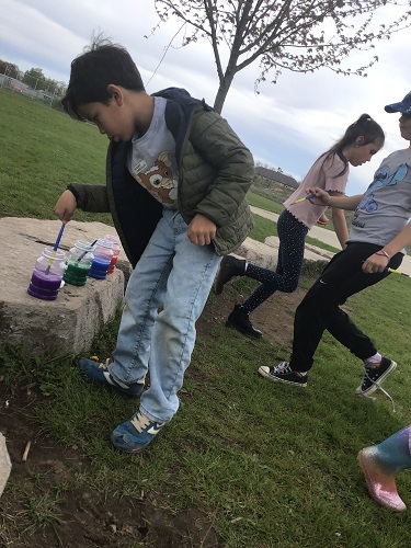 Children painting outdoors
