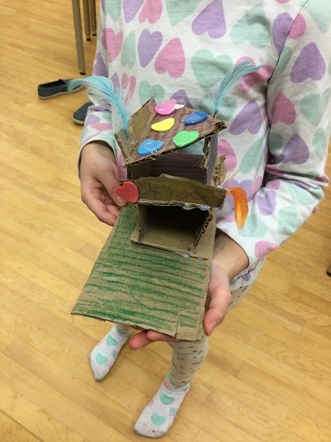 Another cardboard gingerbread house made by school-age child 