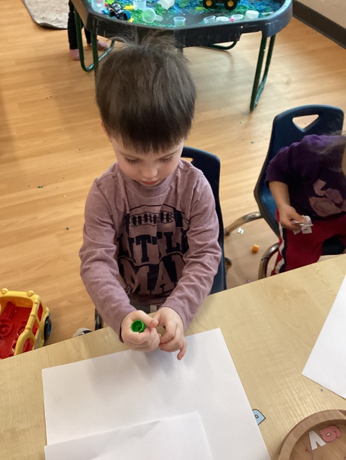 A child exploring with letters.