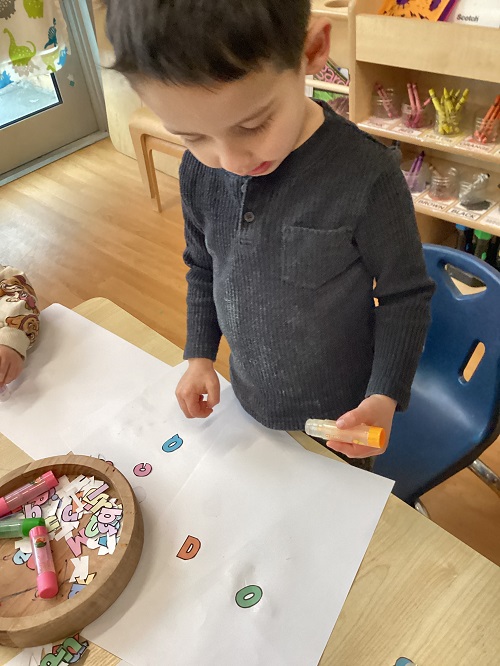 A child exploring with letters.
