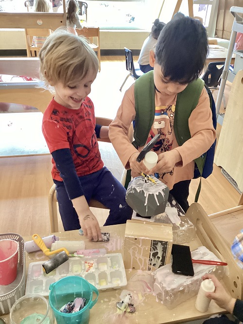 Children exploring with glue