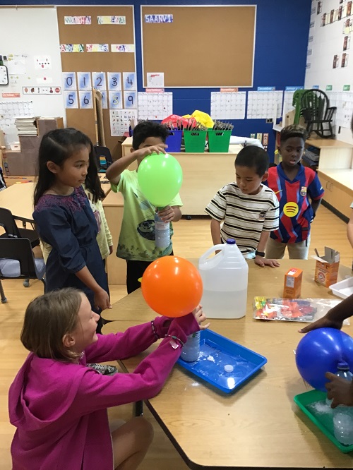 School age children participating in a science experience