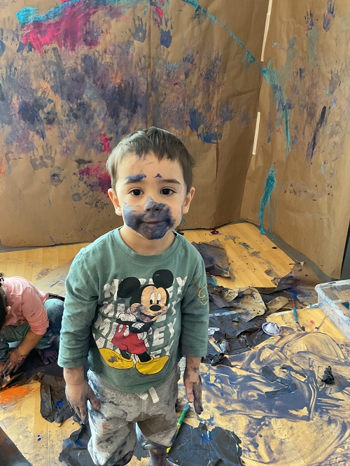 1 child covered in paint