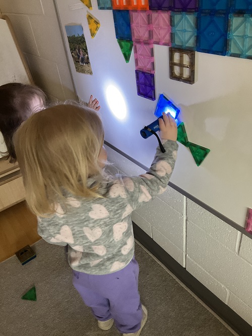2 children at the white board