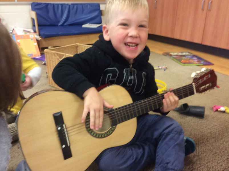 boy playing guitar