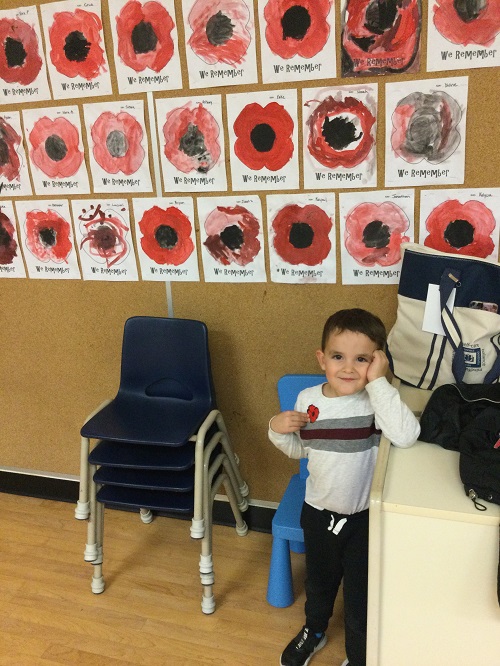 Child showing off his poppy