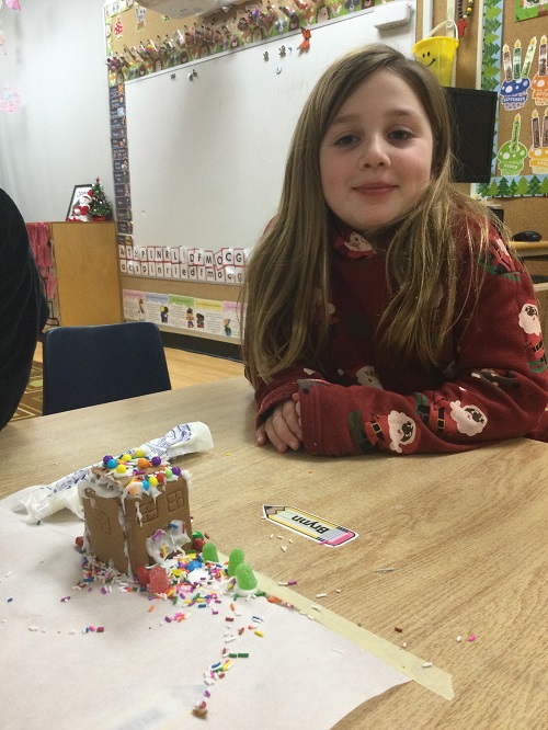 Girl with gingerbread house