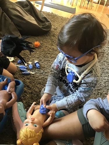 Finley listening to the babies heart