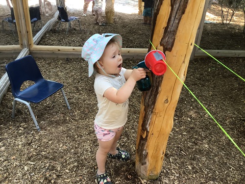 Child moving cup with string