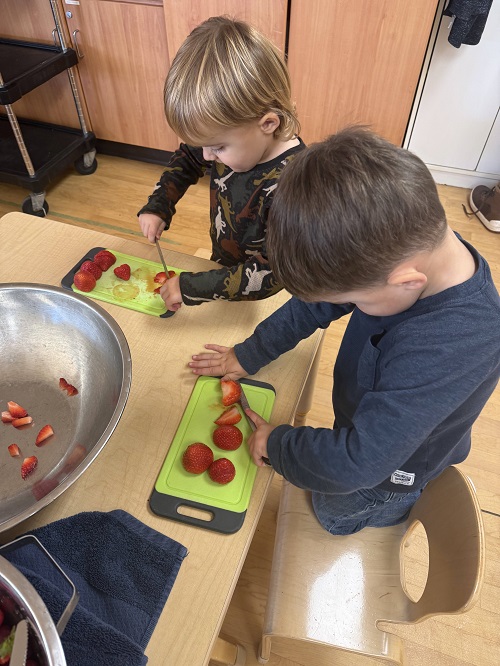 children cutting fruit