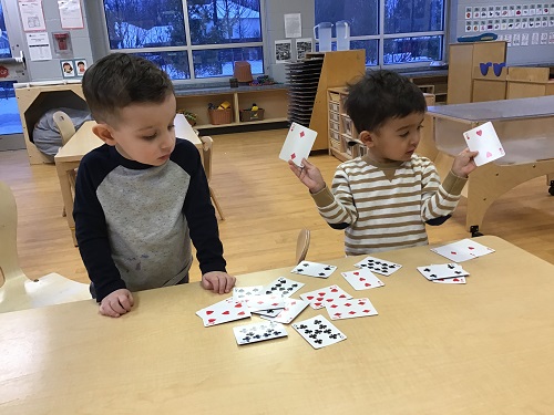 Child showing their peer they found a match