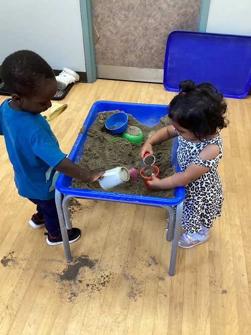Children playing with sand.
