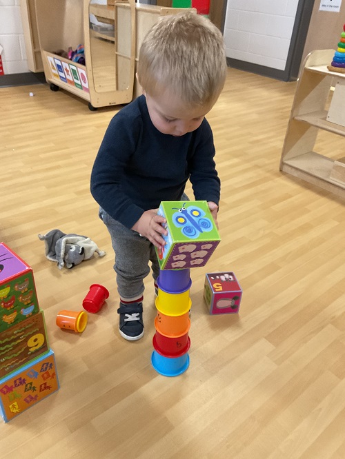 child building a tower
