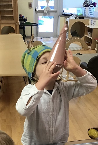 A child pretending to eat ice cream